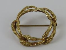 A 14ct gold wreath brooch, London import hallmark, 3cm dia, 4g.