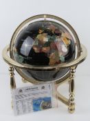 A 'Gemstone Globe' handcrafted with minerals and semi-precious stones including Lapis Lazuli powder