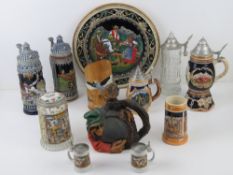 A quantity of late 20th century German steins and tankards in ceramic and glass.
