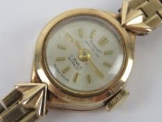 A delightful 9ct gold vintage ladies wristwatch on 9ct gold strap,