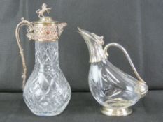 A good heavy cut glass and silver plated claret jug having lion and shield finial, 31.5cm high.