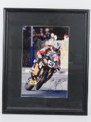 An autographed photo of John McGuinness on his HM Plant Honda Motorbike (Isle of Man TT),