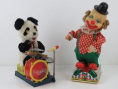A c1970s 'Mambo' electric bear drummer, being a panda with a drum kit. 26cm high.