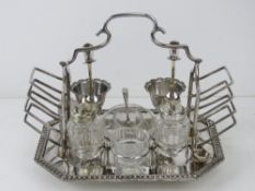 A late Victorian silver plated breakfast set comprising side toast racks,