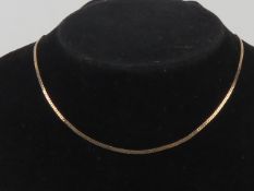 A 9ct rose gold articulated 'S' link chain, having London import hallmark, 40cm in length, 2.9g.