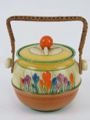 A Clarice Cliff Bizarre pattern waffer / biscuit barrel, in the Crocus pattern, wicker handle,