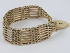 A fine substantial 9ct gold 7-bar bracelet having heart padlock clasp,
