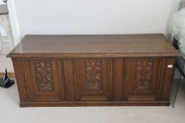 A carved oak panel fronted marriage ches