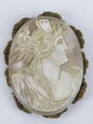A large carved shell cameo of classical