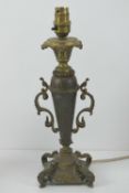 A brass table lamp in the form of an urn
