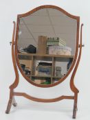 An Edwardian mahogany shield shaped toil