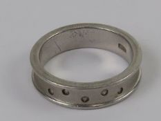 A silver band set with five diamonds, ri
