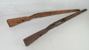 Two KAR98 wooden stocks, one has a maker