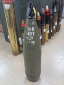 An inert 155mm projectile with fuse stan