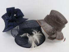 A John Lewis natural fibres hat, together with a Maddox 100% straw hat, and another similar.