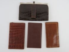 A vintage leather faux crocodile skin purse, and three leather wallets. Four items.