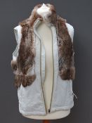 A ladies poly cotton gilet having rabbit fur trim, made by Chiensee size L.