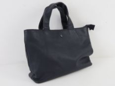A contemporary navy blue leather handbag bearing label Yoshi Litchfield,