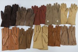 Nine pairs of ladies leather and suede gloves in cream, tan and brown.