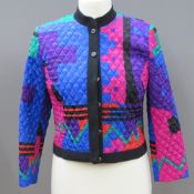 A 1980s jacket of colourful geometric fabric,