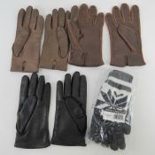A pair of mens driving gloves,