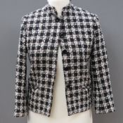 Designed and made by Rosemarie van Bree; a black and cream tweed jacket,