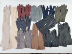 Eleven pairs of ladies leather and suede gloves in grey, burgundy, navy and blush.