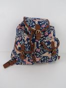 A navy and pink butterfly themed rucksack 'as new', approx 34 x 33cm.