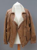 A men's tan leather jacket having faux sheepskin lining, size S, approx measurements 46