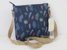 An 'as new' cross body bag in navy floral pattern by Nicole Brown 22 x 22cm.