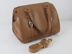 A contemporary brown leather handbag by River Island, 25cm wide.