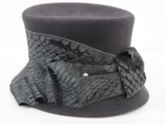 Bailey Tomlin London; a 100% fur felt hat complete with faux pearl hat pins, approx size 7.