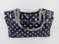 A blue polka dot pattern handbag 'as new', approx 39 x 26cm.