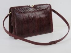 A vintage red leather reptile skin handbag bearing label Ackery London, suede lining,