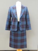 Designed and made by Rosemarie van Bree; Two piece jacket and skirt suit in blue tartan,