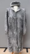 A vintage curly Persian lamb wool coat with matching hat,