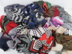 A quantity of assorted scarves and shawls, some silk noted.