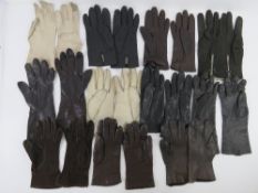 Eleven pairs of ladies leather and suede gloves in cream, brown and black.
