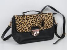 A black leather and 'leopard skin' handbag by Clarks, 28 x 19cm.