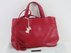 A red leather Radley handbag with blush dog 'tag' upon. Also a Radley leather coin purse.