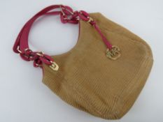 A Michael Kors bag having hot pink patent leather handles, approx 26 x 27cm.