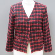 Designed and made by Rosemarie van Bree; a red and black tweed jacket,