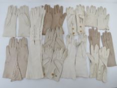 Eleven pairs of leather ladies gloves including elbow length in white and cream