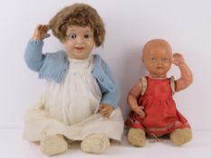 A vintage doll having glass eyes, handpa