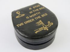 A leather shirt stud box 'A stud in the