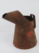 A vintage Esso automotive gallon jug, in