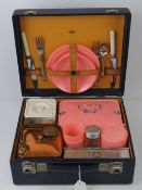 A vintage picnic case by Ilat with conte