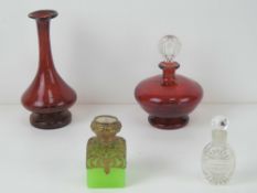 A ruby glass perfume bottle having clear