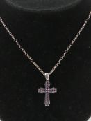 A silver and amethyst cross or crucifix