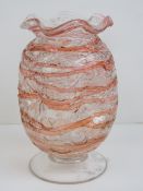 A dimpled and footed glass vase having h